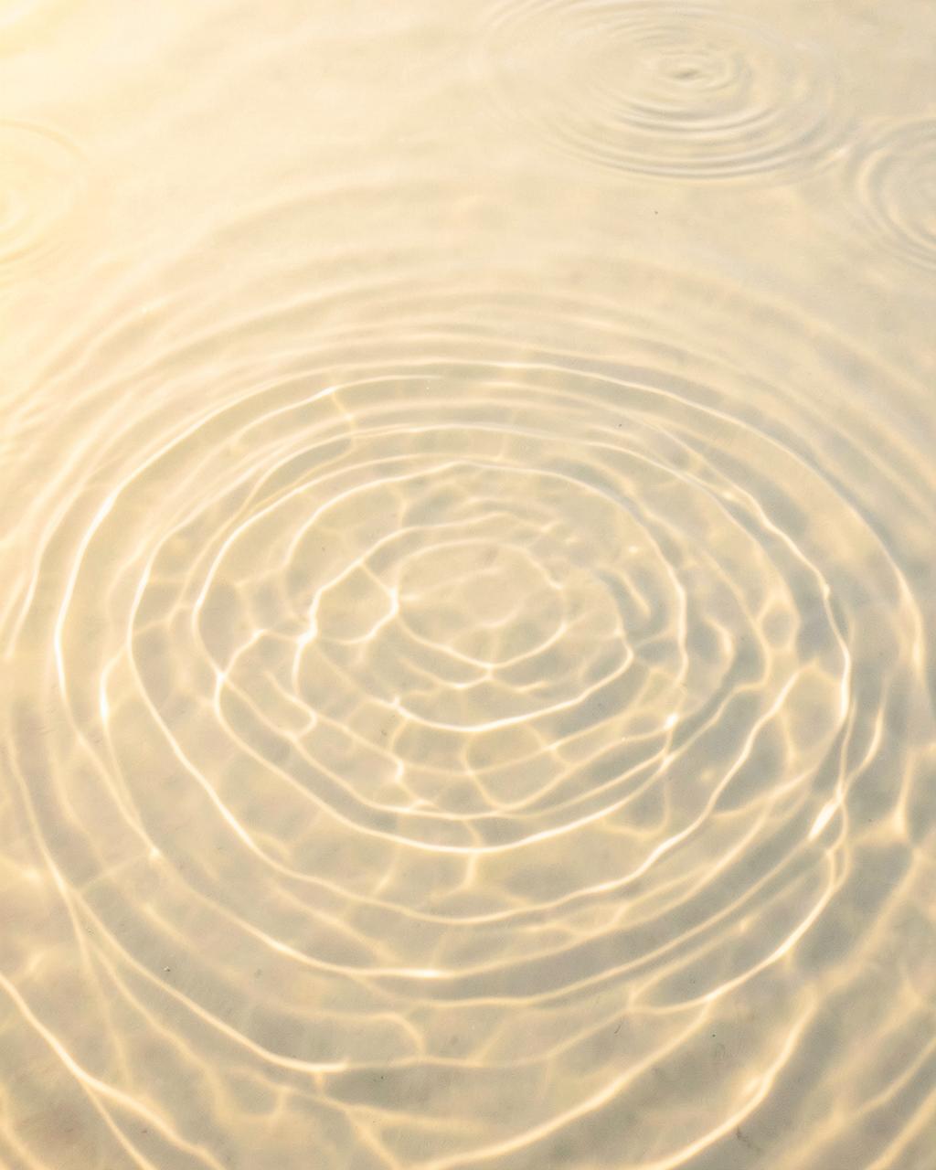 Ripples of water in golden light